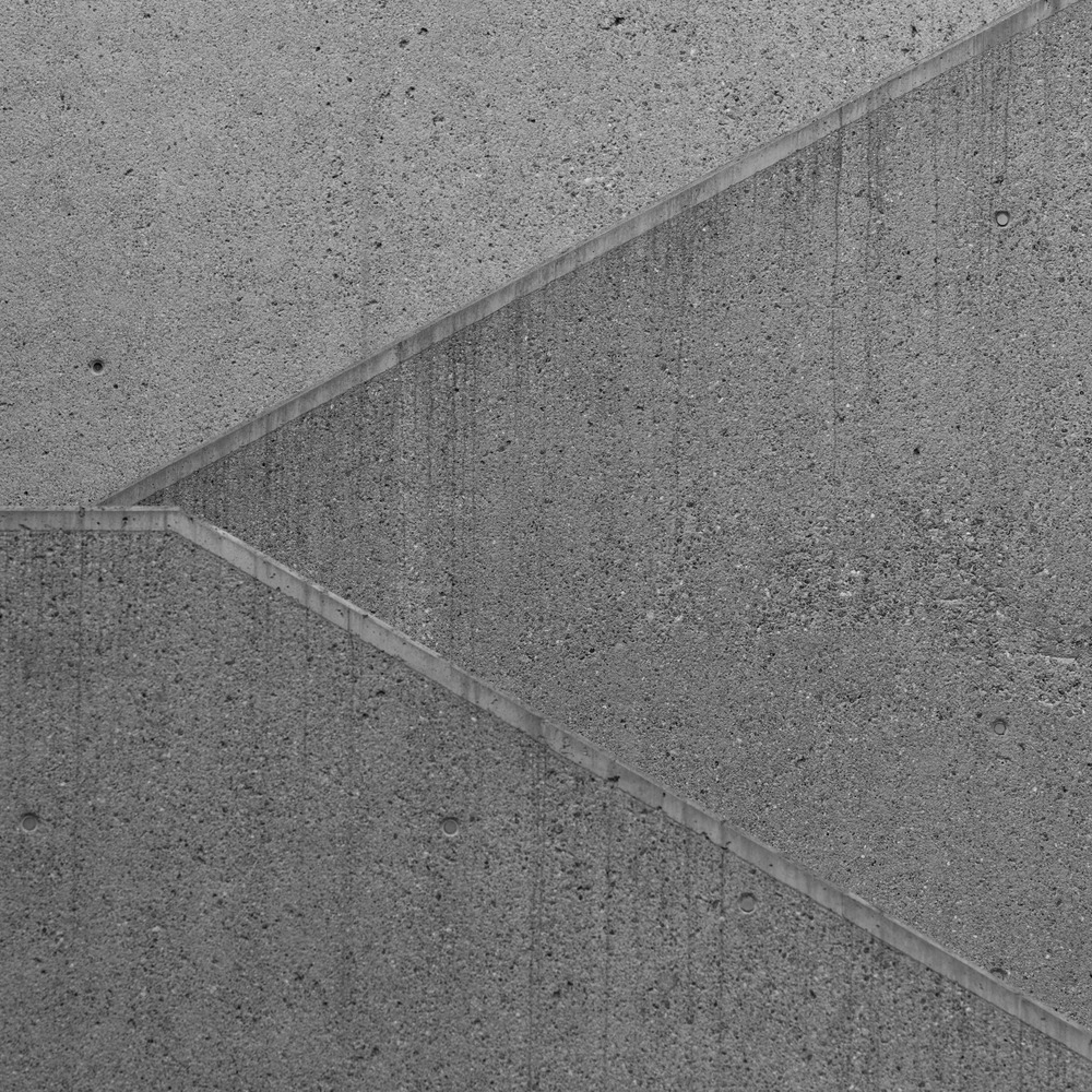 Close-up of intersecting joints in a concrete surface